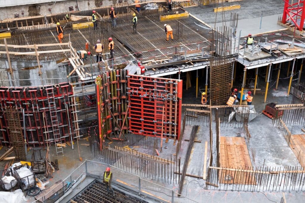 Workers on a busy construction site