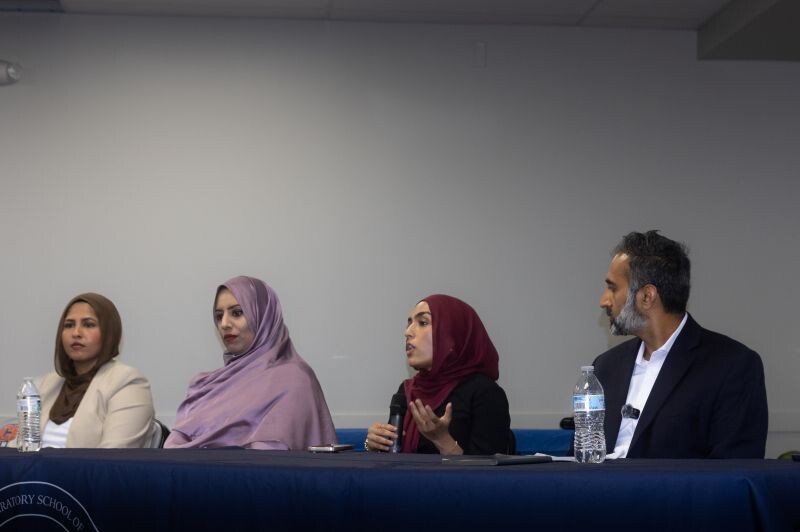 Furqan Mohammed seated with three fellow panelists at the Muslim Pre-Law Conference 2026 at College Preparatory School of America