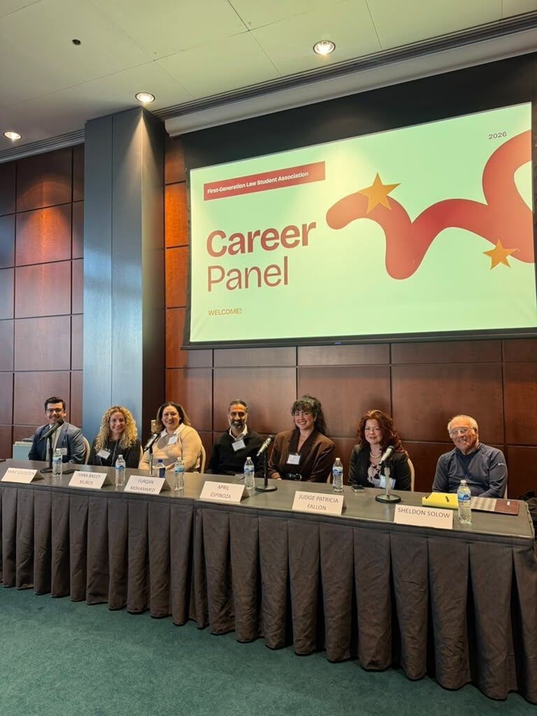 Furqan Mohammed seated with fellow panelists at the Chicago-Kent First-Generation Law Student Association career panel