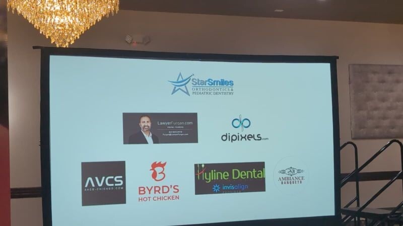 Sponsor slide displayed at the Chicagoland for Palestine fundraiser in Villa Park