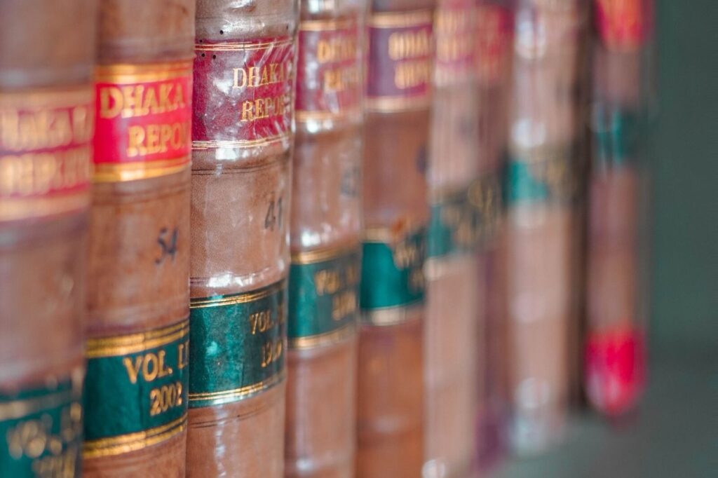 Leather-bound law books on a library shelf
